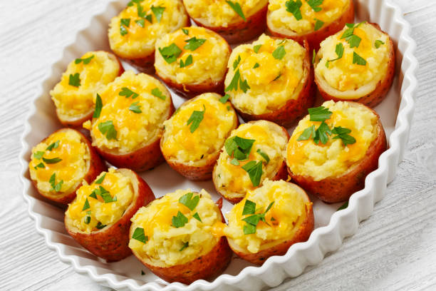 istock baked stuffed red potato on white baking dish 1572493063