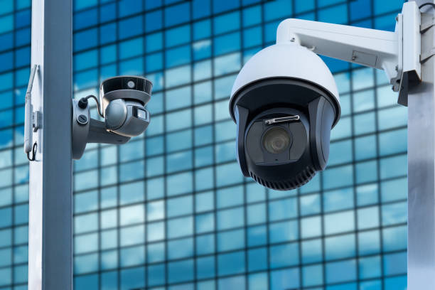 istock Security, CCTV camera in the office building. Close-up 1572507181