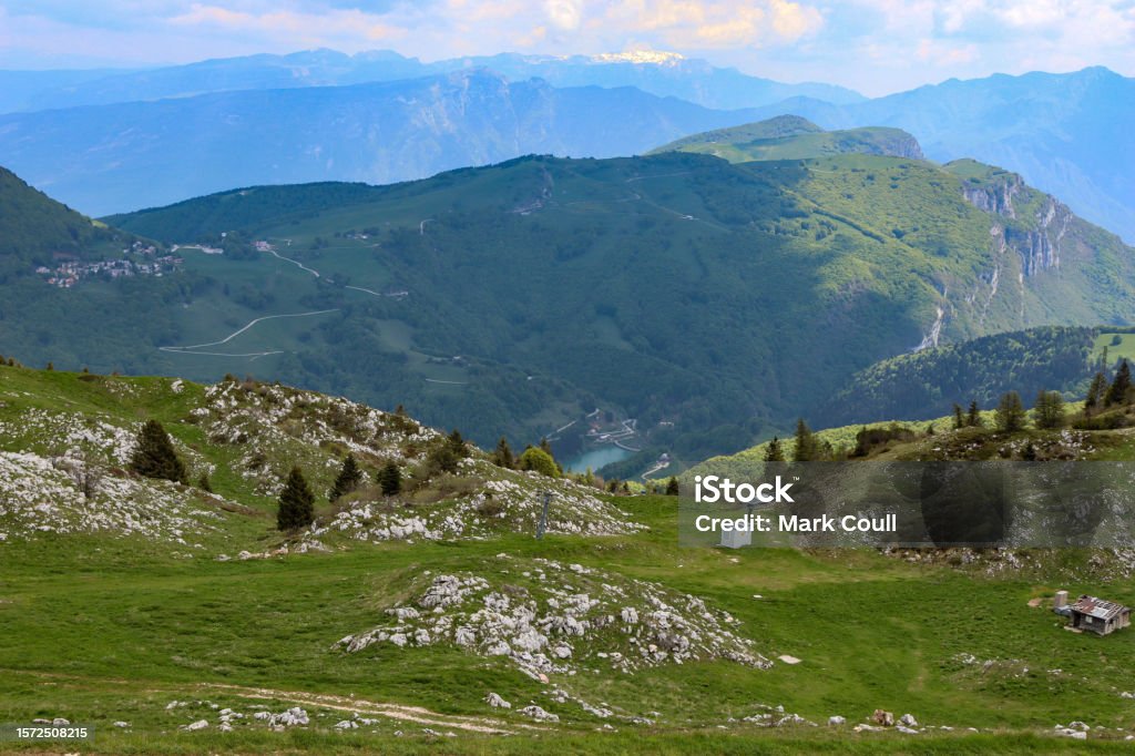On top of Monte Baldo after a cable car Great scenic view after coming out cable car looking at a lake, mountains, trees and sky Beauty Stock Photo