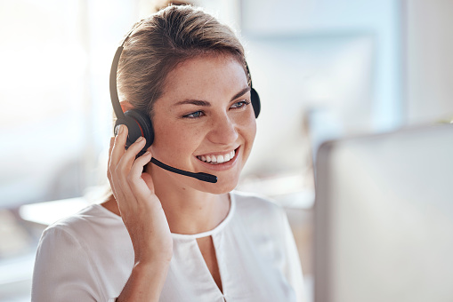 Call center, computer and smile with woman in office for customer service, technical support and advice. Technology, contact us and communication with employee operator in help desk agency