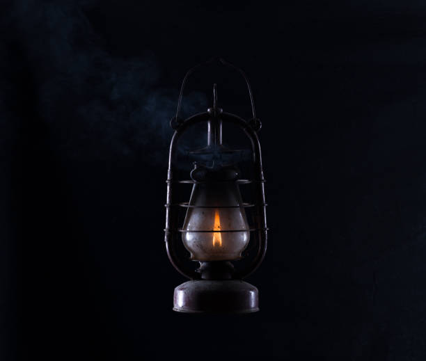 istock rusty dirty kerosene lamp isolated on black background 1572533293