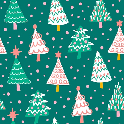 Cute white, pink and green Christmas trees seamless pattern on green background. Holiday season winter forest fun repeat pattern. Hand drawn illustration. Gift bag, fabric, paper design.