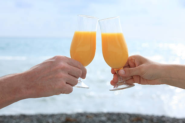 istock Hands with glass against a sea 157254491