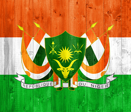 Flag and coat of arms of Republic of Niger on a textured background. Concept collage.