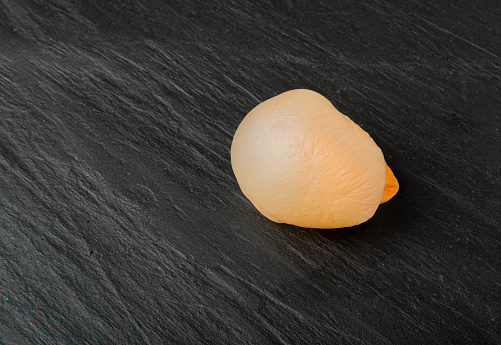 Peeled Pomelo fruit - black background.