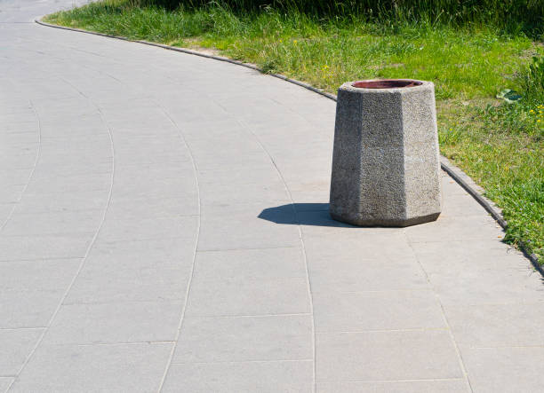 istock Concrete Garbage Bin in Park, Massive Vandal-Resistant Trash Can, Big Heavy Waste Bin for Mix Trash 1572573815