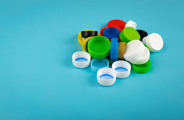 istock Plastic Bottle Caps Pile. Recycling HDPE Material Group, Circle Polyethylene Lid Set, Colorful Caps Group 1572576973