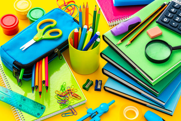istock Composition of multi colored school supplies shot on yellow background 1572580168