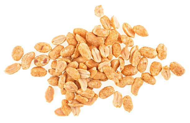 istock Roasted and peeled peanuts isolated on a white background, top view. Spiced peanuts. 1572587535