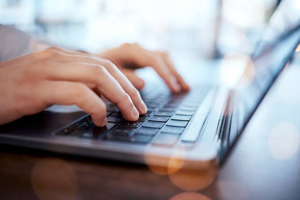 istock Hands typing, man and laptop on desk with internet research for writing online article for social media news. Remote work, freelance writer and blog, content marketing with hand on computer keyboard. 1572595611