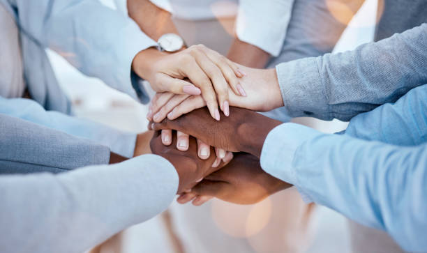 istock Business people, hands or solidarity stack for collaboration, team building or trust. Teamwork, huddle or group of staff with men, women and hand together for community, unity and support motivation 1572596653