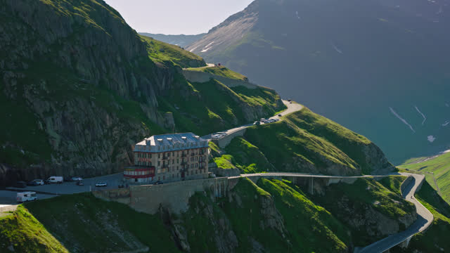 Cars Winding Up Hairpin Bends in Furka Pass - Aerial