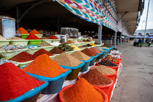 Traditional Chorsu bazaar with spices in Tashkent, Uzbekistan.