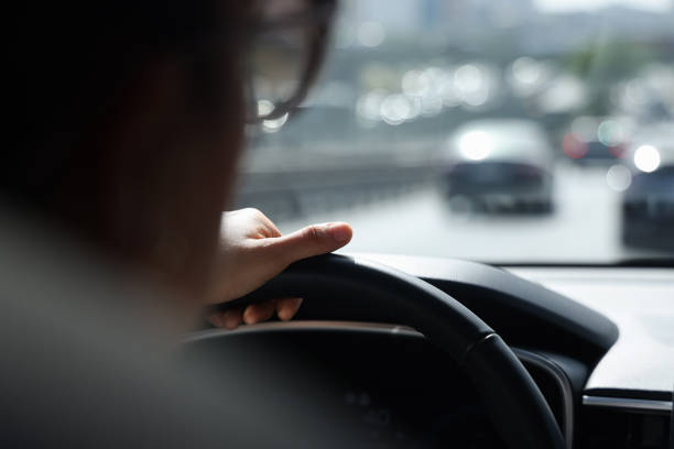 istock Woman holding the steering wheel 1572645579