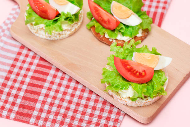 istock Rice Cake Sandwiches with Tomato, Lettuce and Egg 1572645604