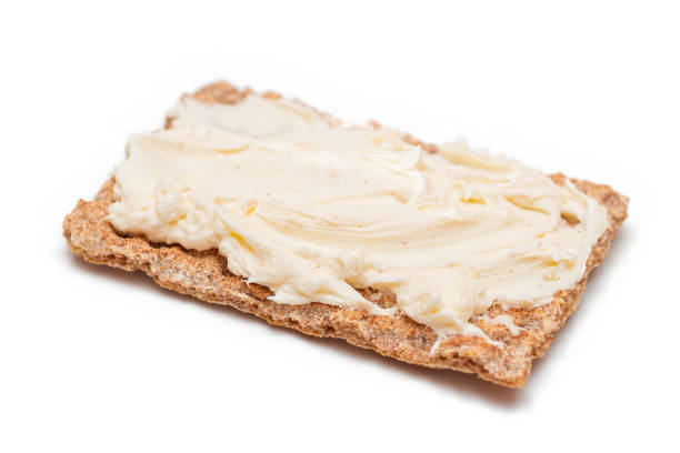 istock Whole Grain Crispbread with Cream Cheese - Isolated 1572646646