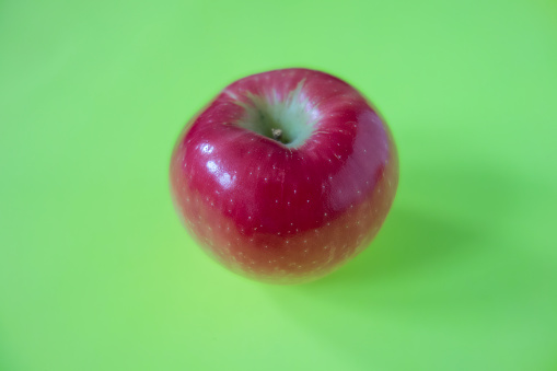Group of fresh organic red apple on green background