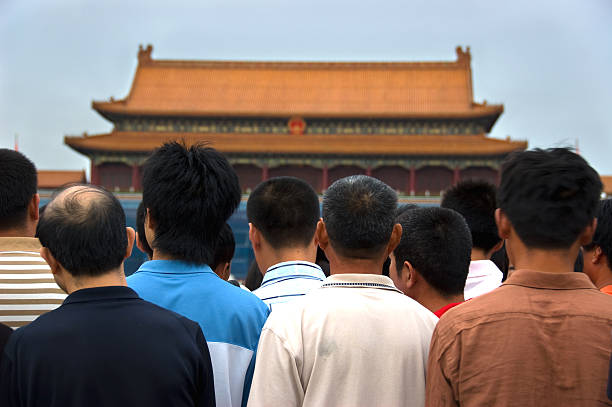 Beijing, China - October 27, 2015: Large crowed of tourists near The Hall of Supreme Harmony in the Forbidden City in Beijing China. Hall of Supreme Harmony is the largest hall within the Forbidden City.