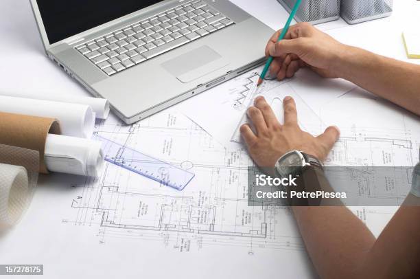 Person Working On Measurements For A Drawing Of A Building Stock Photo - Download Image Now