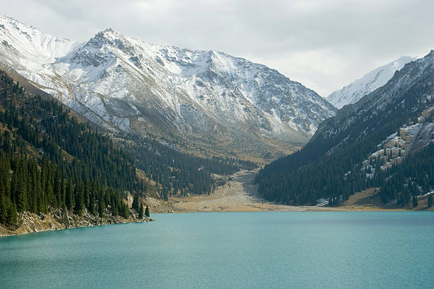 湖アルマティ - extreme terrain eroded snow landscape ストックフォトと画像