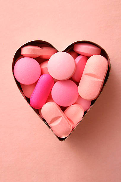 pink liebevolle details - pink pill stock-fotos und bilder