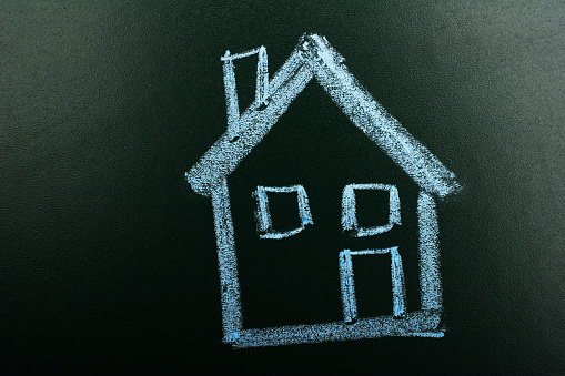 House in chalkboard with blue chalk