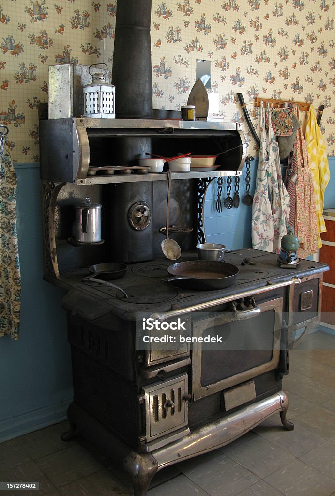 Wood Stove century old wood stove in an old kitchen Appliance Stock Photo
