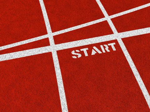 The word START on a synthetic athletics track. 3D render with HDRI lighting and raytraced textures.