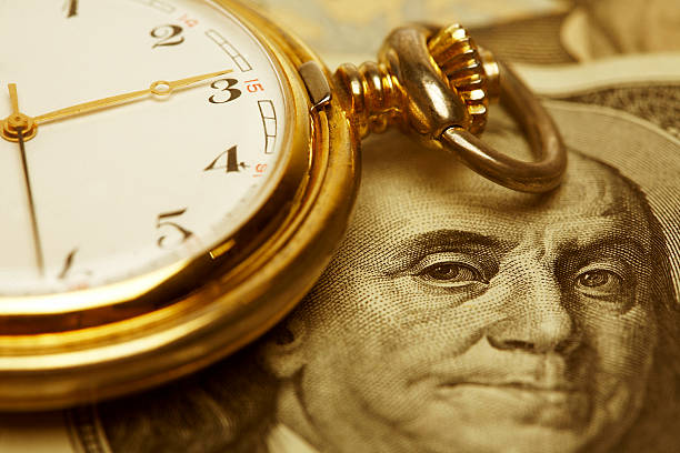 Close up, Time and Money. Gold Tone.