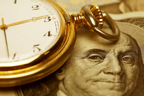 Close up, Time and Money. Gold Tone. stock photo