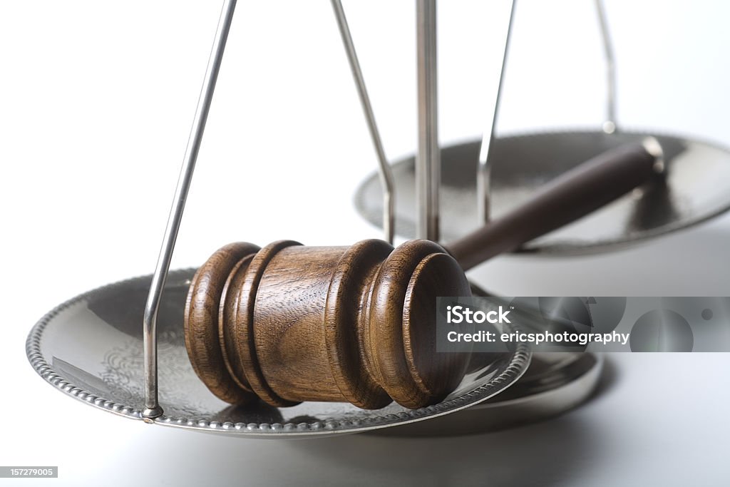 Gavel on silver scale of justice  Equal-Arm Balance Stock Photo