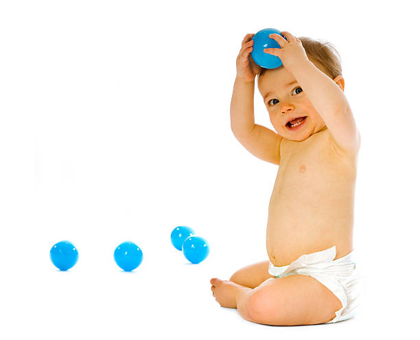 istock Small baby in nappy playing on white background 157279584