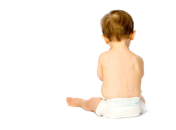 istock Back of small baby boy in nappy isolated on white 157279649