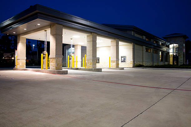 Drive thru banking. Bank, ATM. Night.