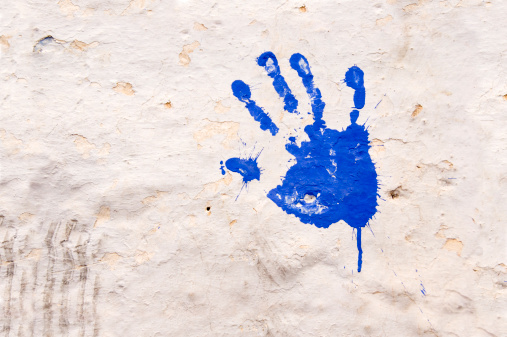 Blue hand print on a wall in Fez Morocco