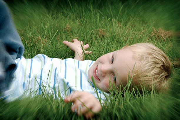 Boy on Grass  oxford michigan photos stock pictures, royalty-free photos & images