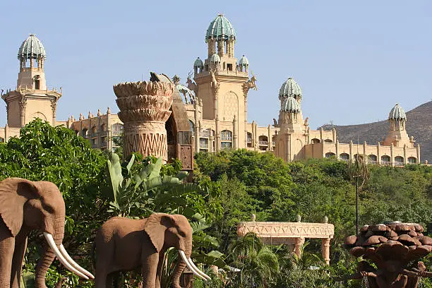 Photo of South African palace surrounded by trees and elephants