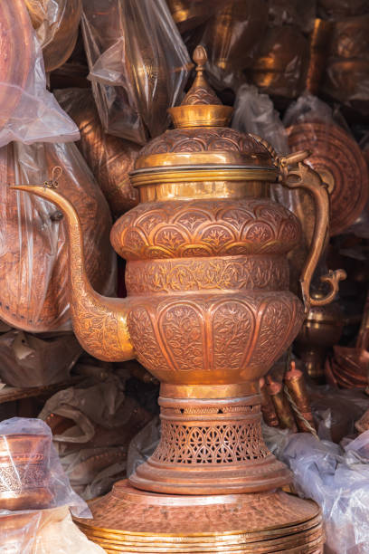 Sokalipura, Srinagar, Jammu and Kashmir, India. Copper tea urns at a market in Srinagar.