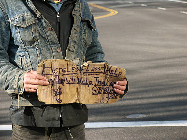 Homeless Guy with Dirty Denim Jacket and Sign  stray animal stock pictures, royalty-free photos & images