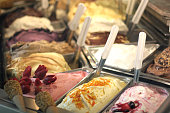 Close-up of several flavors of gelato in a store window