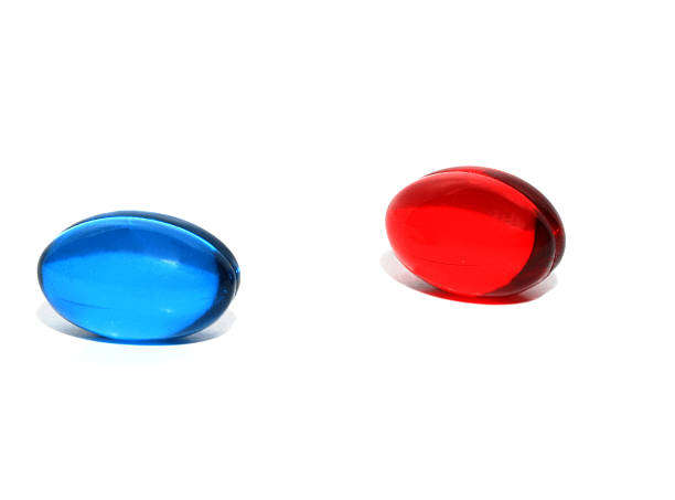 レッドまたはブルーの錠剤 - vitamin pill red pill capsule ストックフォトと画像