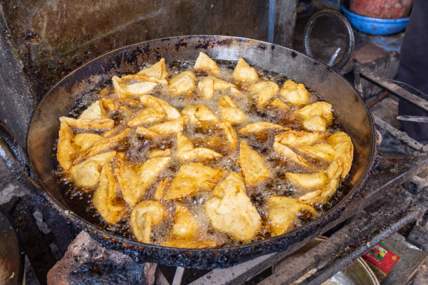 istock Frying somosas at a market in Srinagar. 1572811991