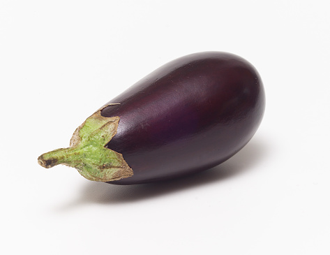 Eggplant shot on clean white background with soft drop shadow.