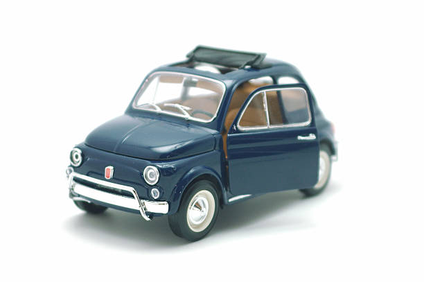 little fiat 500 car toy a little toy of italian car isolated on white background toy car stock pictures, royalty-free photos & images