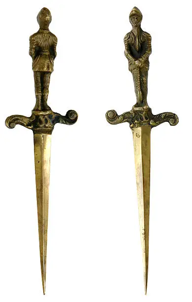 Gold medieval daggers.  Bought from at a collectors estate auction, most items were from the late 1800's to early 1900's.  Believed to be used as a letter opener.
