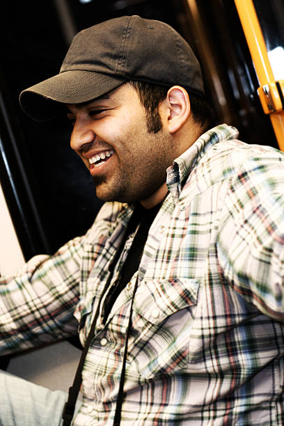 istock Happy Young Man Riding on Public Transportation 157281942