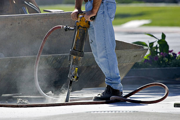 Jack-Hammer Chipping Away One Piece at a Time  hydraulic hose stock pictures, royalty-free photos & images