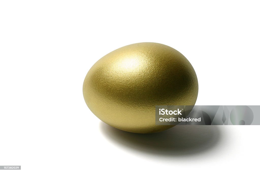 Golden Egg on Isolated White Background Golden egg against isolated white background. Clipping path included. Gold Colored Stock Photo