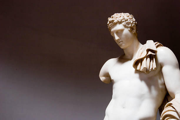istock A beige roman statue on a gray background. 157282032