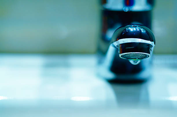 Faucet Detaill of a modern faucet head. arid climate stock pictures, royalty-free photos & images